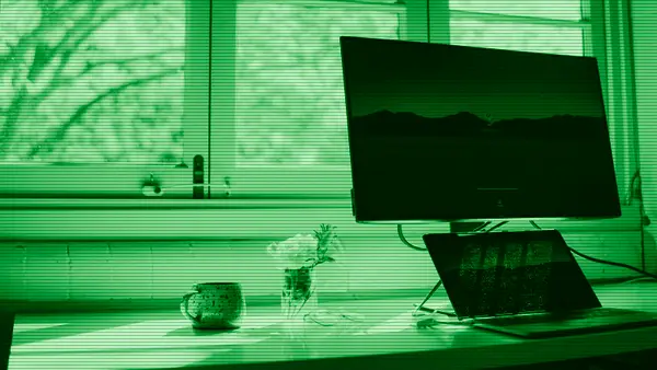 A laptop and a monitor on a work desk
