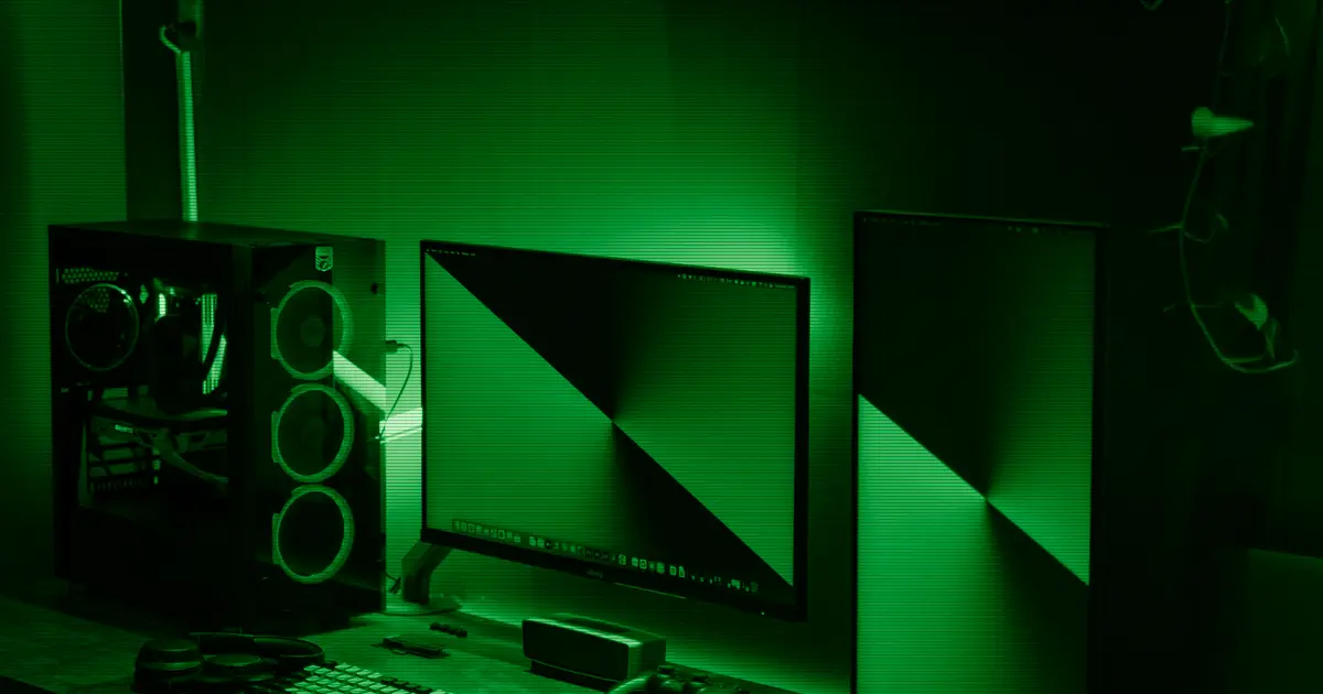 A desk with a dual-monitor setup