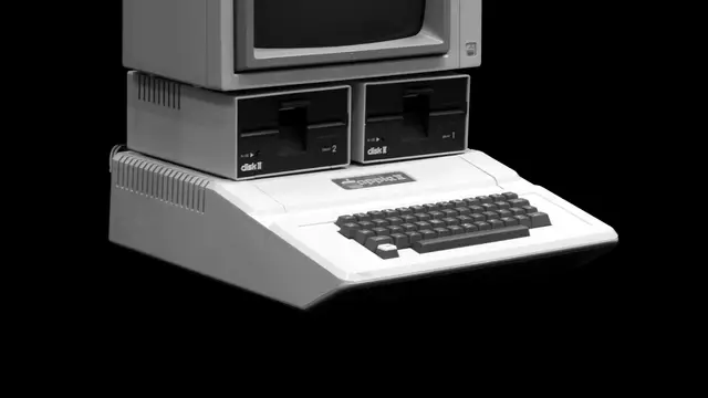 Apple II computer with monitor and two Disk II floppy drives