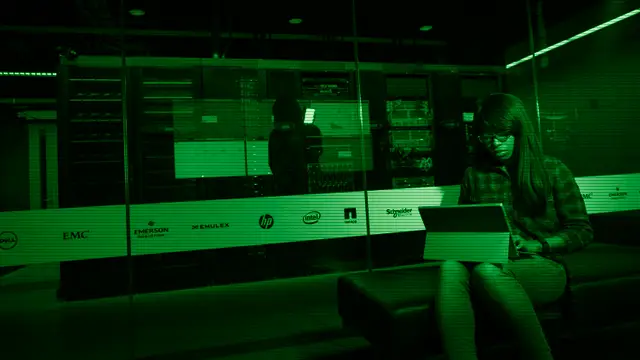 Server room with code on screen, evoking the infrastructure that Linux powers today