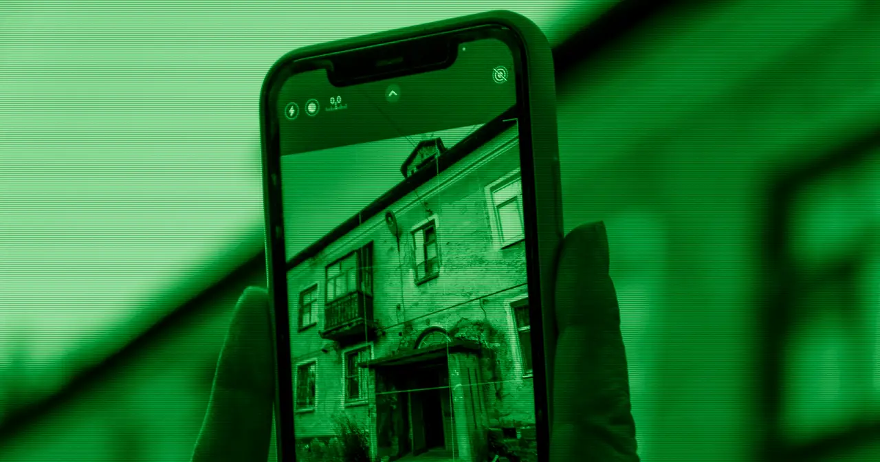 Hand holding an old smartphone given a second life