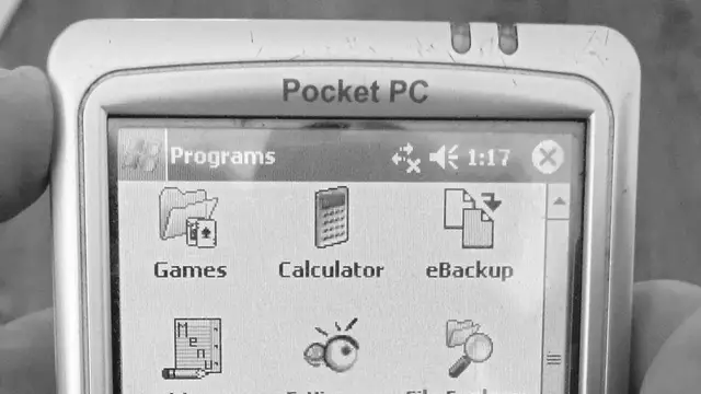 Mio 168 DigiWalker PDA running Windows Mobile 2003 showing the Programs menu on screen